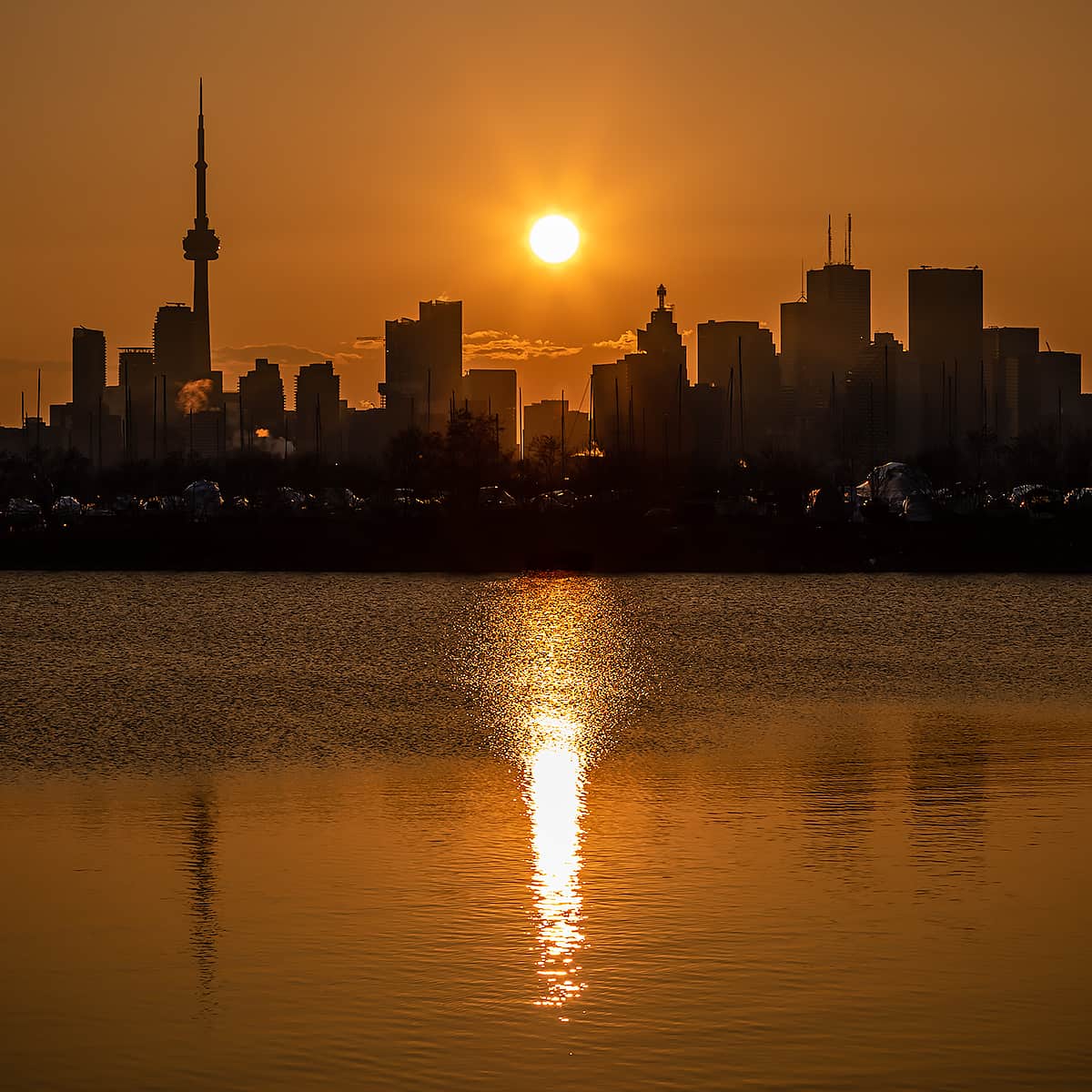 Golden sunset silhouette of Toronto skyline skyscrpapers