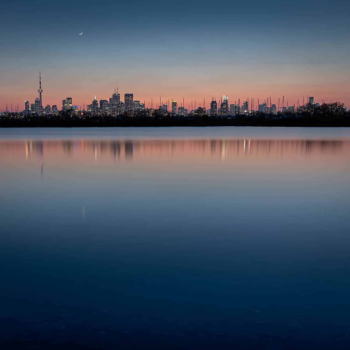 Toronto skyline at twilight reflection Lake Ontario